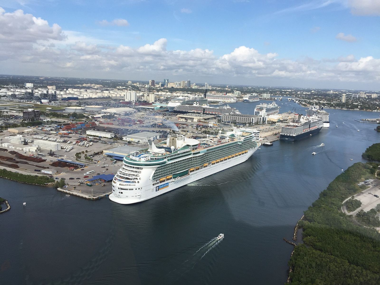 Aerial view of a cruise ship sailing out of Port Everglades past the terminals
