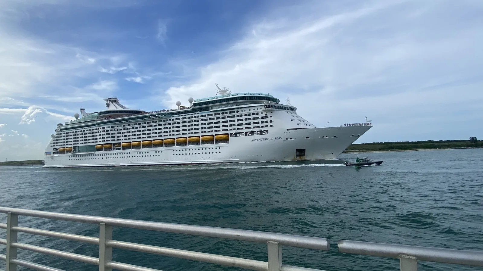 Cruise ship sailing out of Port Canaveral past a jetty