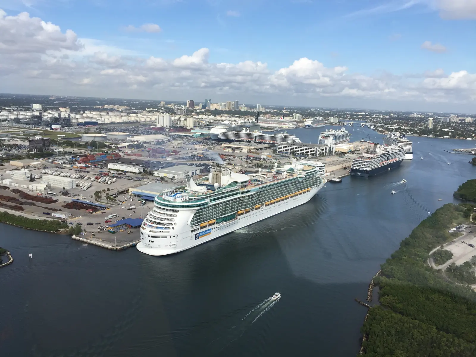Aerial view of a cruise ship sailing past the docks at Port Everglades in Fort Lauderdale