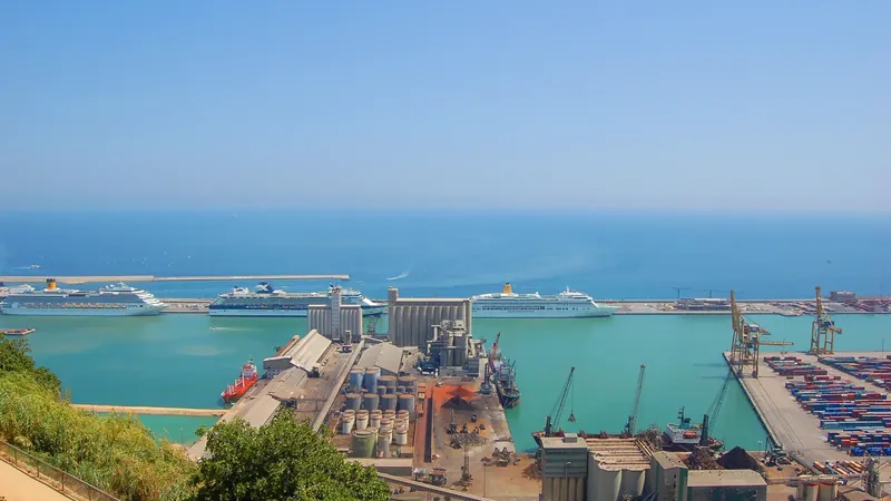 Cruise terminal buildings and docked ships at the Port of Barcelona on a sunny day