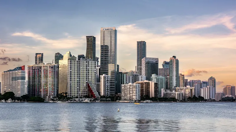 Downtown Miami towers across the water at dusk