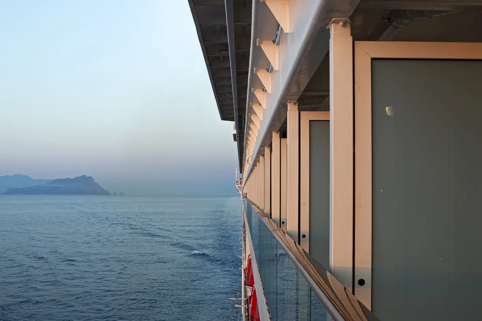 View along a row of cruise ship balconies over the sea