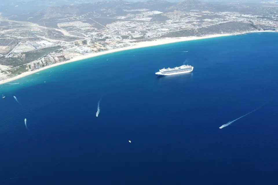 Cruise ship anchored in a blue bay