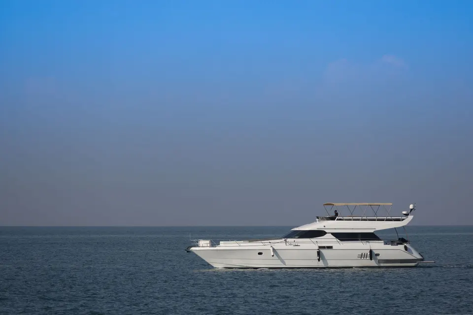 White motor yacht on calm water