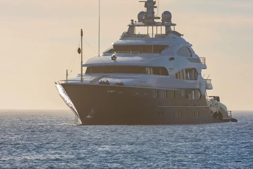 Superyacht at sea in soft evening light