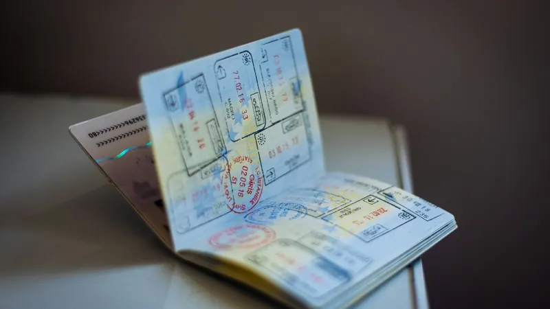 Open passport with ink stamps on its pages