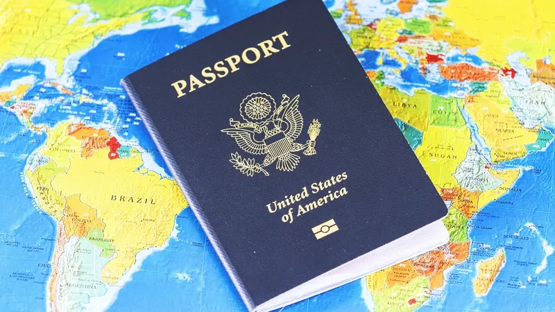 Passport and colorful travel map laid out for trip planning